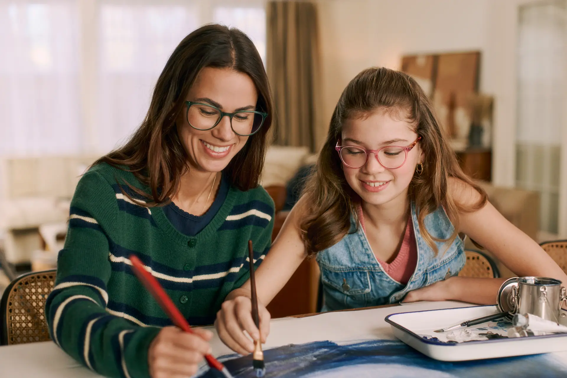 Mother and daughter wearing eyeglass frames