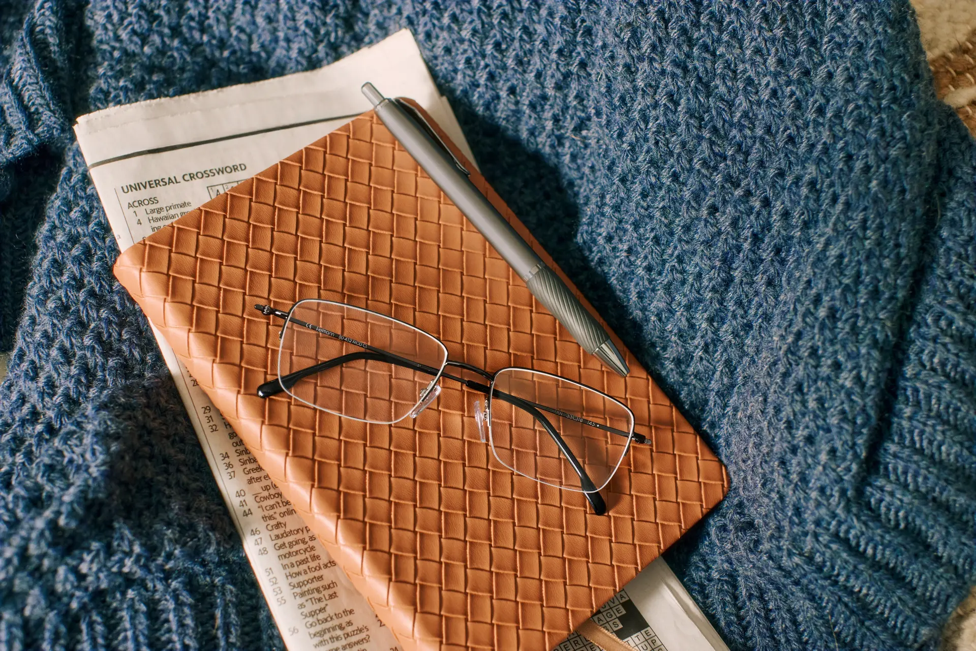 Eyeglasses resting on a notebook