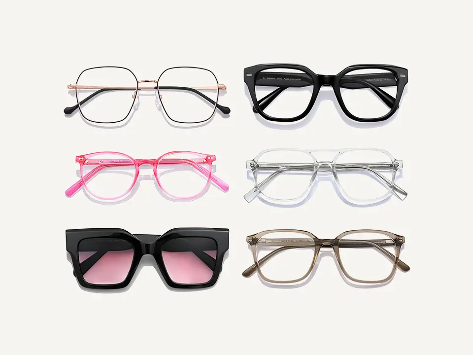Six pairs of eyeglasses arranged in two columns: metallic, black, pink, clear, black with pink lenses, and brown frames.